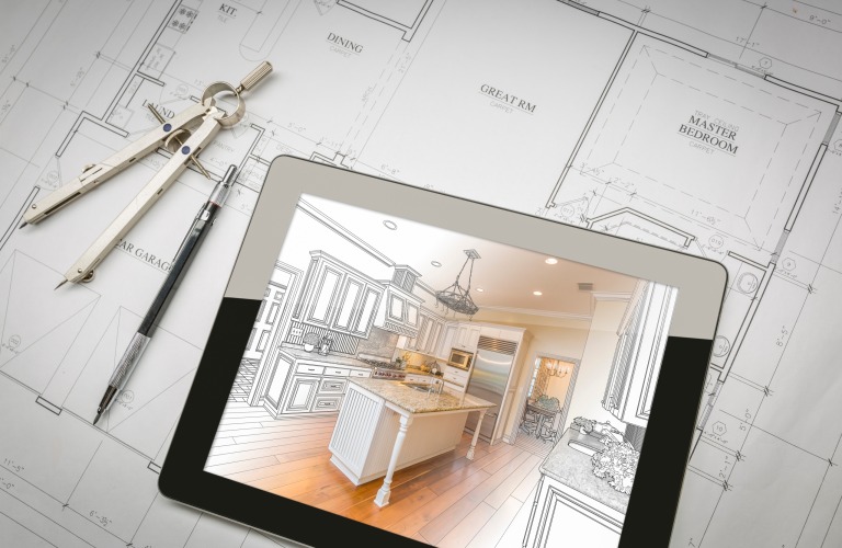 Computer Tablet Showing Kitchen Illustration Sitting On House Plans With Pencil and Compass.