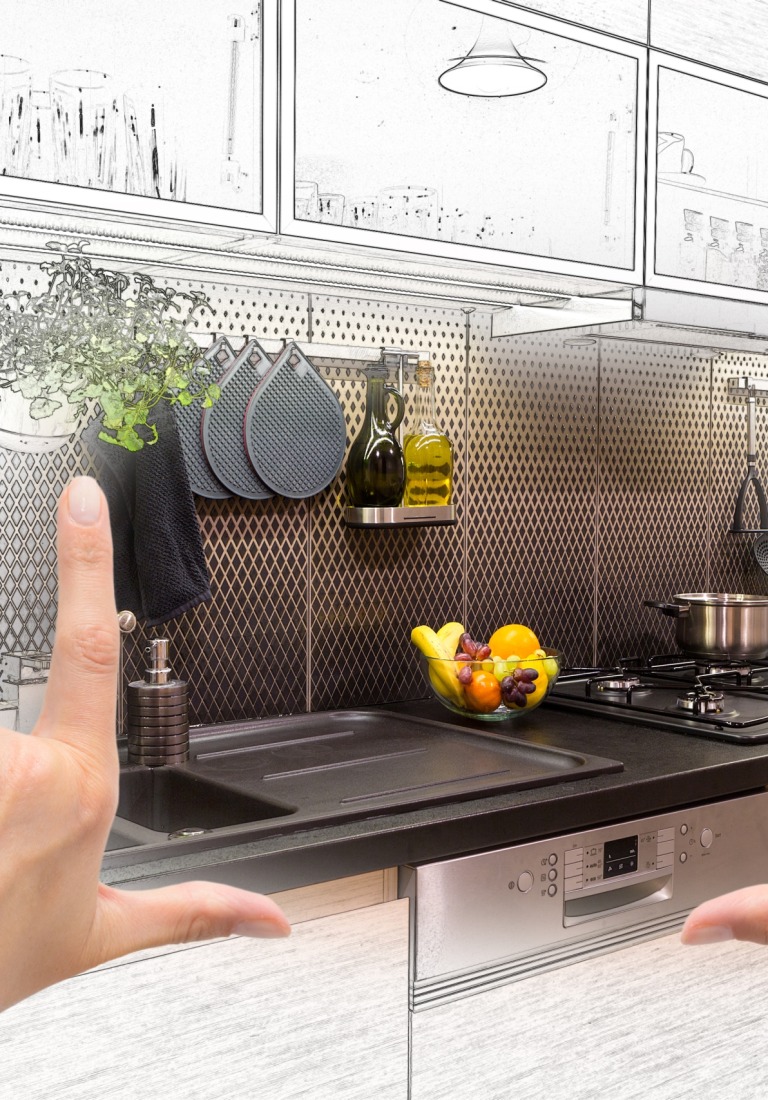 Female hands framing custom kitchen design. Combination drawing and photo.